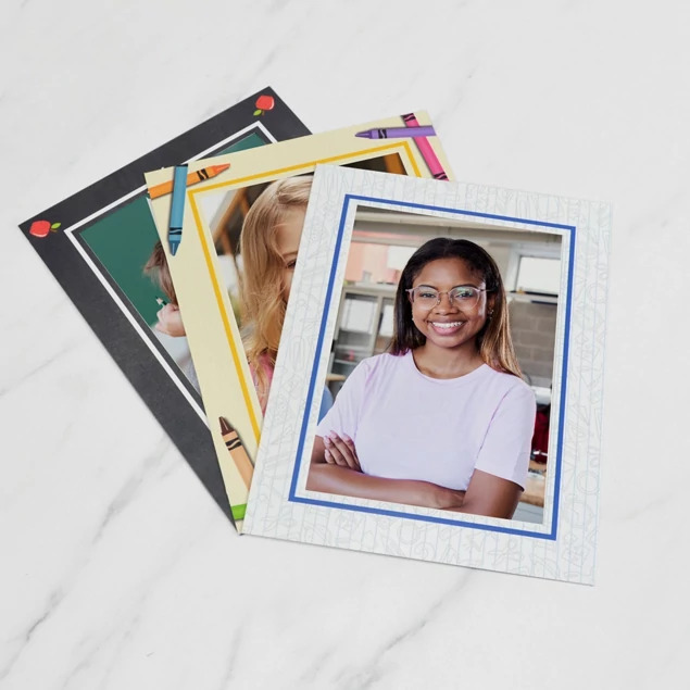 Crayon Panel Mount shown with other school photo products on marble surface