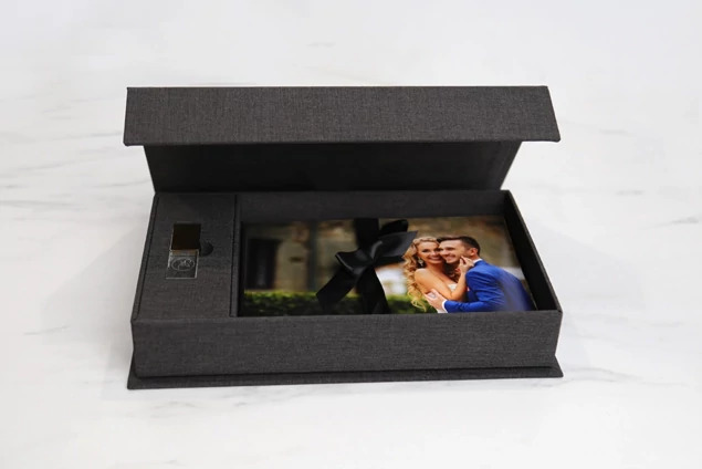 Dark gray Tyndell Carbon Fabric Flash Drive USB and Print Box 5x7 with satin ribbon closure.